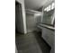 Bathroom featuring tiled shower with sliding glass door and vanity at 6250 W Flamingo Rd # 88, Las Vegas, NV 89103