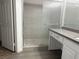 Bathroom featuring tiled shower with sliding glass door and vanity at 6250 W Flamingo Rd # 88, Las Vegas, NV 89103