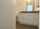 Bright bathroom featuring a white vanity with a gray countertop at 6250 W Flamingo Rd # 88, Las Vegas, NV 89103