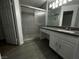 Bathroom featuring tiled shower with sliding glass door and vanity at 6250 W Flamingo Rd # 88, Las Vegas, NV 89103