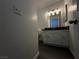 Bathroom featuring a white vanity, vinyl floors, and modern lighting at 6250 W Flamingo Rd # 88, Las Vegas, NV 89103