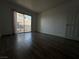 Large bedroom featuring plank floors and a sliding glass door at 6250 W Flamingo Rd # 88, Las Vegas, NV 89103