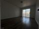 Bedroom featuring plank floors and sliding glass doors to the outside at 6250 W Flamingo Rd # 88, Las Vegas, NV 89103