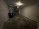 Spacious garage with gray door and overhead lighting at 6250 W Flamingo Rd # 88, Las Vegas, NV 89103