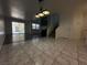 Open-concept home featuring tile and wood floors with a back entrance view and a staircase at 6250 W Flamingo Rd # 88, Las Vegas, NV 89103
