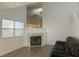 Cozy living room features a fireplace, large window, and comfortable sofa at 6250 W Flamingo Rd # 88, Las Vegas, NV 89103