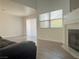 Open living room with fireplace, large window, and sliding door at 6250 W Flamingo Rd # 88, Las Vegas, NV 89103