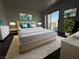 Modern main bedroom featuring a king-size bed and access to a private balcony with great natural light at 6250 W Flamingo Rd # 88, Las Vegas, NV 89103