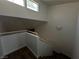 Bright, freshly painted staircase leads to upper level, featuring modern wall sconce at 6250 W Flamingo Rd # 88, Las Vegas, NV 89103