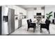 Modern kitchen with stainless steel appliances, white cabinetry, and a dining area perfect for Gathering meals at 641 Bellus Pl # Lot 149, Henderson, NV 89015