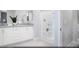 Elegant main bathroom with dual sinks, white cabinetry, and a glass-enclosed shower for a spa-like experience at 641 Bellus Pl # Lot 149, Henderson, NV 89015