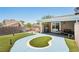 Serene backyard featuring a charming grass area and well-maintained patio at 667 Del Prado Dr, Boulder City, NV 89005