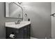 Charming bathroom features a modern sink, vanity and fixtures, creating a sleek and inviting space at 667 Del Prado Dr, Boulder City, NV 89005