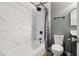 Bathroom featuring tile flooring, shower and tub with stylish tile surround, and a modern sink at 667 Del Prado Dr, Boulder City, NV 89005
