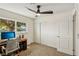 Bedroom features a ceiling fan, a window and closet for a comfy and efficient living space at 667 Del Prado Dr, Boulder City, NV 89005