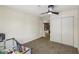 Bedroom features a ceiling fan and closet providing ample storage space at 667 Del Prado Dr, Boulder City, NV 89005