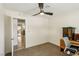 Bedroom featuring carpet flooring, ample lighting, and a view to other parts of the house at 667 Del Prado Dr, Boulder City, NV 89005