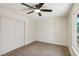 Clean and bright bedroom with carpet flooring, a window, and a closet with sliding doors at 667 Del Prado Dr, Boulder City, NV 89005