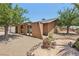 Single story home with desert landscaping and unique arched entryway at 667 Del Prado Dr, Boulder City, NV 89005