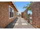 Home exterior with desert landscaping and arched walkway at 667 Del Prado Dr, Boulder City, NV 89005