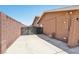 Property exterior with block fence and secure gate at 667 Del Prado Dr, Boulder City, NV 89005