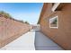 Property exterior with long driveway and decorative block fence at 667 Del Prado Dr, Boulder City, NV 89005