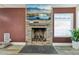 Stacked stone fireplace with wooden mantle adds charm to the living space at 667 Del Prado Dr, Boulder City, NV 89005