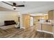 Open concept kitchen featuring bright wood cabinets, laminate countertops, and stainless-steel appliances at 667 Del Prado Dr, Boulder City, NV 89005