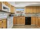 Close up on kitchen featuring light wood cabinets and stainless steel appliances at 667 Del Prado Dr, Boulder City, NV 89005