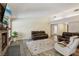 Spacious living room with fireplace and comfortable leather seating arrangement at 667 Del Prado Dr, Boulder City, NV 89005