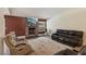 Cozy living room with fireplace, large windows and comfortable seating at 667 Del Prado Dr, Boulder City, NV 89005