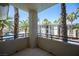 Private balcony offers a relaxing outdoor space with views of palm trees at 7155 S Durango Dr # 205, Las Vegas, NV 89113