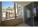 Balcony view with palm trees and view of neighboring buildings at 7155 S Durango Dr # 205, Las Vegas, NV 89113