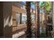 Private balcony with palm trees. offering an inviting outdoor space for relaxation at 7155 S Durango Dr # 205, Las Vegas, NV 89113