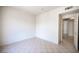 Unfurnished bedroom with tile flooring, a closet, and a light neutral color at 7155 S Durango Dr # 205, Las Vegas, NV 89113