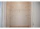 Walk-in closet space with multiple shelves for storage, organization, and tile flooring at 7155 S Durango Dr # 205, Las Vegas, NV 89113