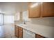 Bright kitchen featuring a double basin sink, ample counter space, and cabinetry at 7155 S Durango Dr # 205, Las Vegas, NV 89113