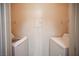 Compact laundry area includes a washer, dryer, and built-in wire shelving at 7155 S Durango Dr # 205, Las Vegas, NV 89113