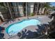 Beautiful community pool and spa surrounded by mature landscaping in a serene setting at 7155 S Durango Dr # 205, Las Vegas, NV 89113