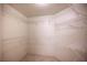 Spacious walk-in closet with wire shelving offers ample storage space at 7155 S Durango Dr # 205, Las Vegas, NV 89113