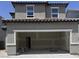 An attached two-car garage offering convenient parking and storage solutions with unfinished drywall at 7341 Daly Grove St, Las Vegas, NV 89113