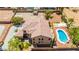 Bird's-eye view of a home showcasing the backyard pool, desert landscape, and architecture of the home at 7794 River Mist Ct, Las Vegas, NV 89113