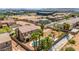 Aerial view of a beautiful home, backyard with pool, and surrounding neighborhood at 7794 River Mist Ct, Las Vegas, NV 89113