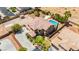 Spacious home with a large pool, lush landscaping, and ample space for outdoor entertaining in a desirable neighborhood at 7794 River Mist Ct, Las Vegas, NV 89113