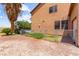 Fenced backyard area featuring a small patch of grass and access to a pool at 7794 River Mist Ct, Las Vegas, NV 89113