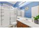 Clean bathroom with a shower over bath, single sink vanity with plenty of counter space at 7794 River Mist Ct, Las Vegas, NV 89113