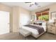Calm bedroom with a neutral color palette, carpet flooring, and window with great light at 7794 River Mist Ct, Las Vegas, NV 89113