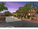 Stately home featuring lush landscaping, a gated driveway, and well-manicured grounds at 7794 River Mist Ct, Las Vegas, NV 89113