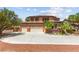 Inviting front exterior with a well maintained lawn and plenty of parking space at 7794 River Mist Ct, Las Vegas, NV 89113