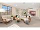 Bright and airy living room with modern furnishings, a staircase, and open layout at 7794 River Mist Ct, Las Vegas, NV 89113